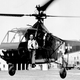 The XR-4 is evaluated by the US Coast Guard, with Igor Sikorsky seated in the hoist sling. (US Coast Guard)